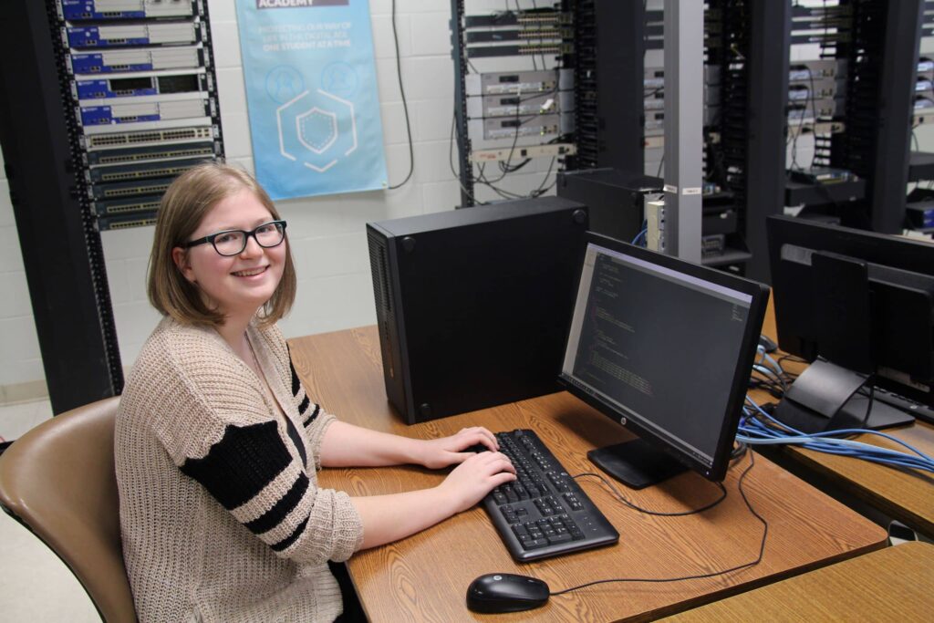 A female student learns to code for a web developer career training program at a Western New York Works college.